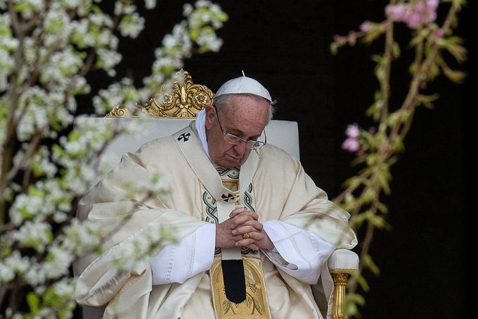 Pope Francis prays on Easter Sunday morning in St. Peter's Square on April 5, 2015. Credit: L'Osservatore Romano.